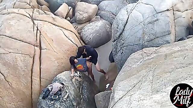 Amateur brunette is moaning while getting her pussy licked by a stranger, on the beach