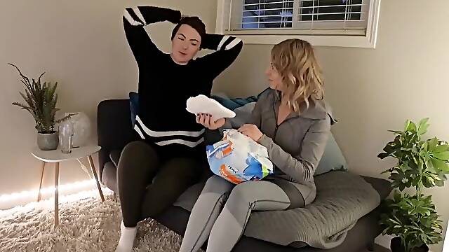 Trying on diapers and clothes