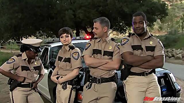 Pretty police woman attracted to a black male counterpart getting cozy at the station