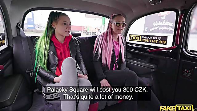 Two rebellious twins having fun with their taxi driver