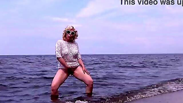 Nimble aged mamma has enjoyment with youthful lads on the beach two