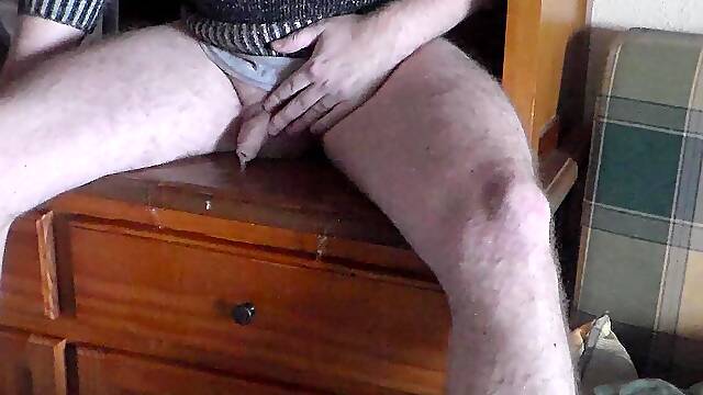 John is pissing all over the bookcase