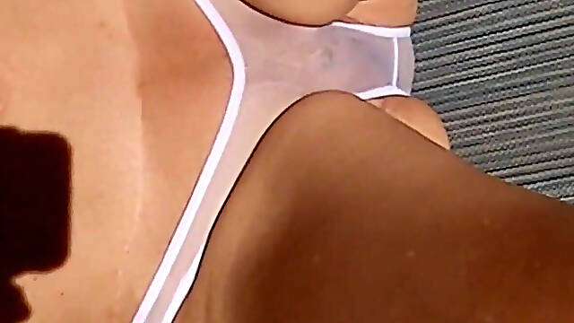 Sunning on the balcony in plain view of everyone walking by